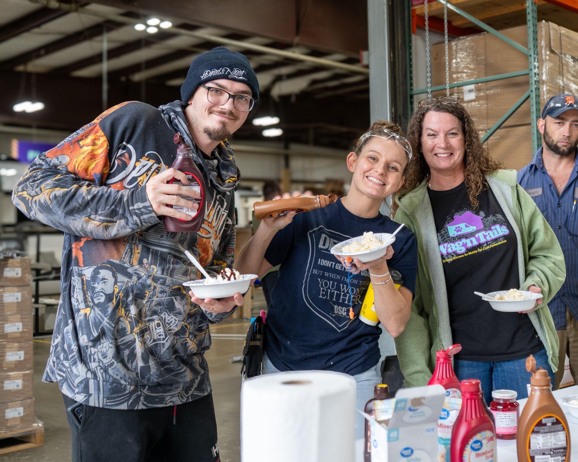 Production teammates sharing an ice cream party on the Wag'n Tails shop floor
