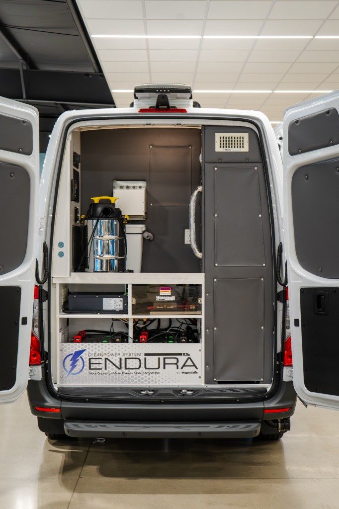 Rear doors open showing CleanPower System Endura bay, lithium batteries, and organized storage
