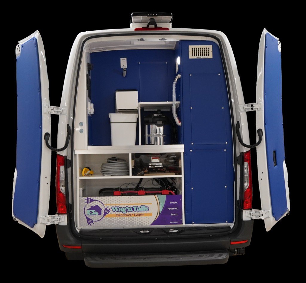 Quantum rear doors open showing CleanPower system and blue salon interior