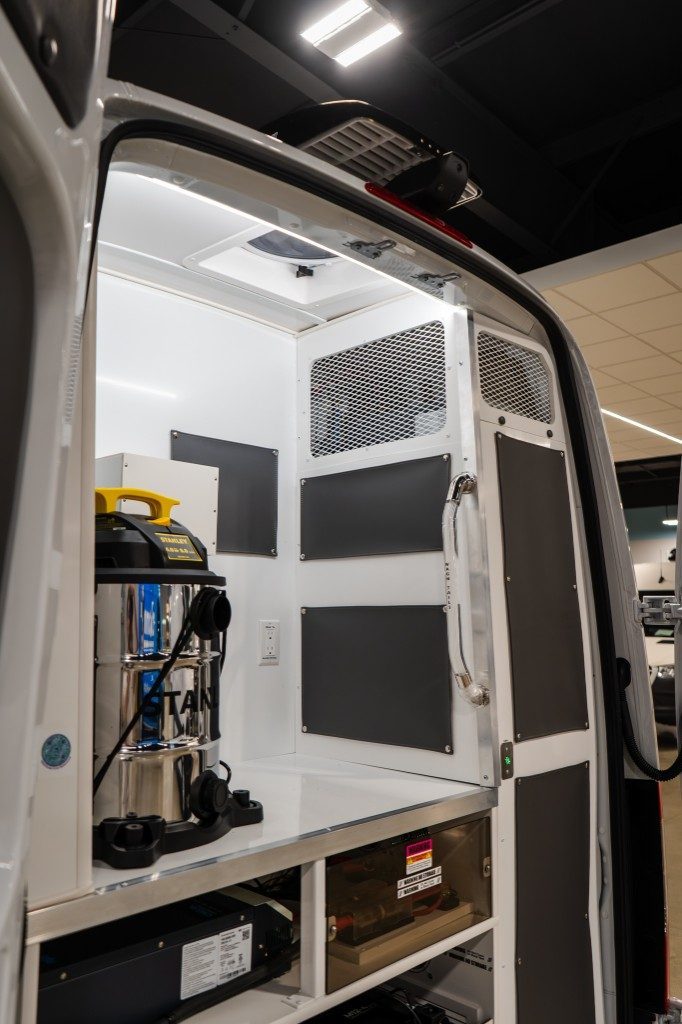 Professional high-velocity dryer secured on a white rear counter with mesh ventilation panels