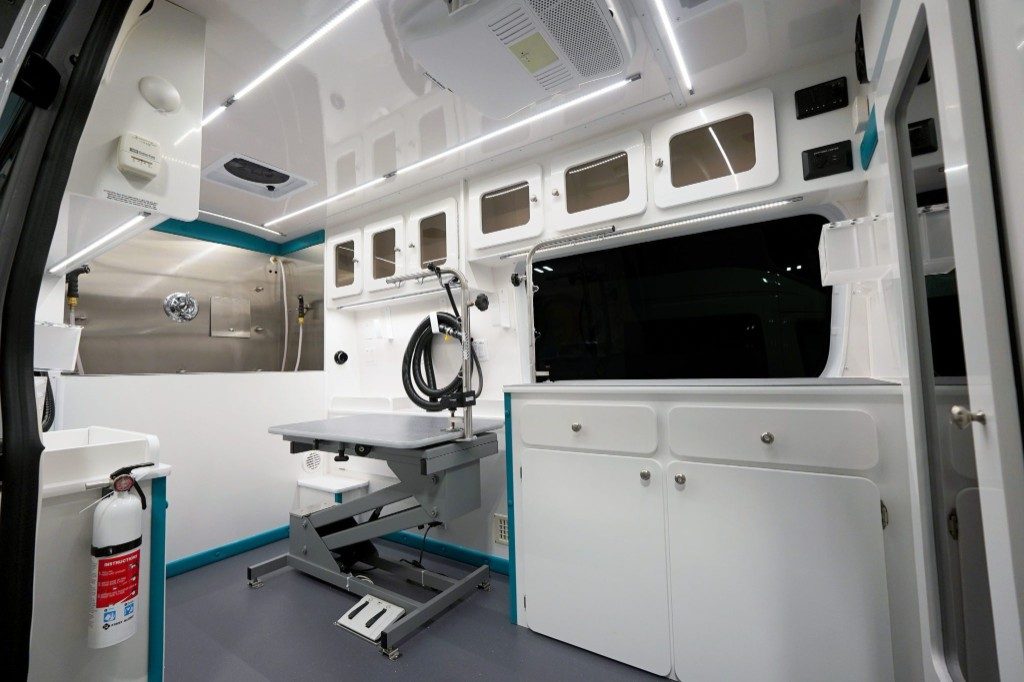 Supreme Groom salon interior workspace with teal accents and room to work