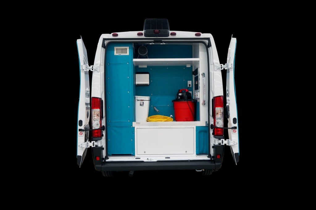 Ultra Groom Van rear doors open showing storage and utility systems