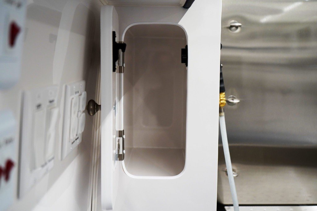 Ultra Groom open storage cubby with organized salon supplies